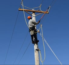 lineman using personal protective grounding