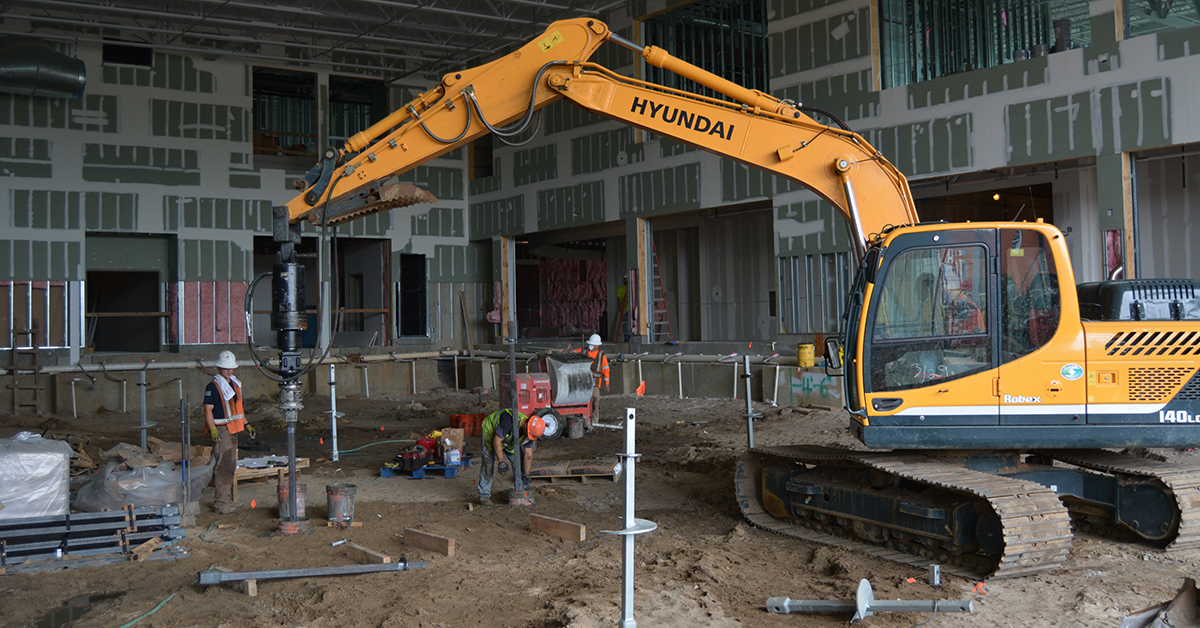 helical pulldown grouted pile installation